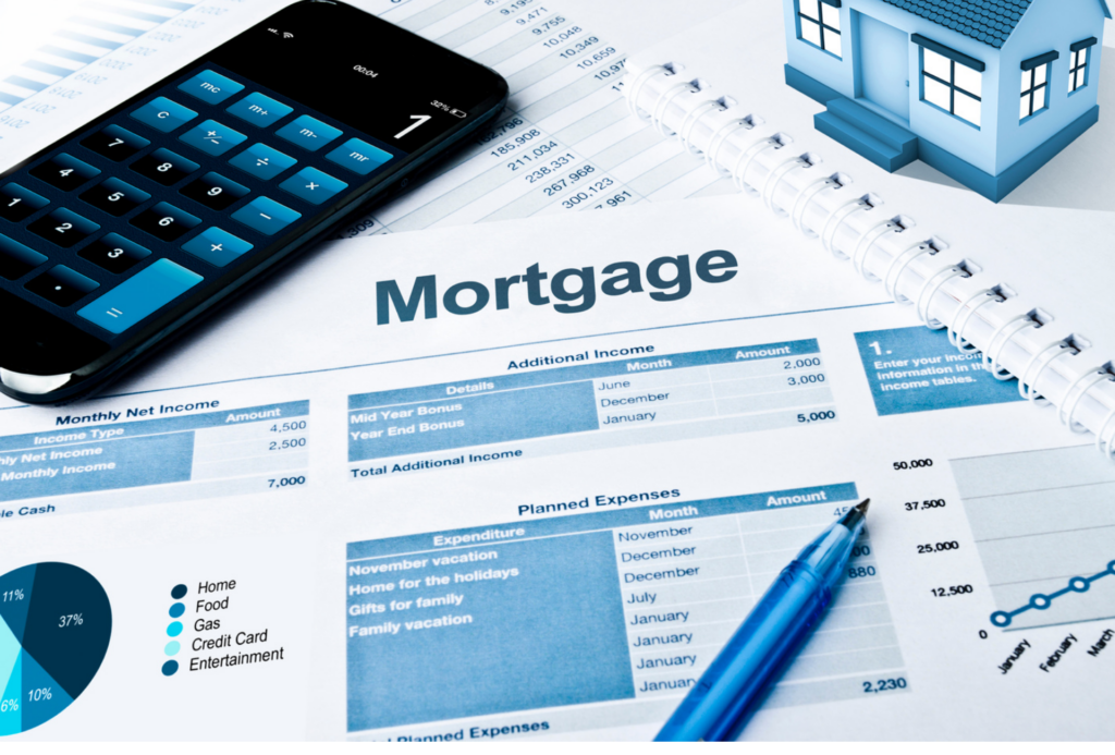 Mortgage documents on a table with a pen and notebook and calculator as a homeowner tries to calculate how much they need to make selling their home to avoid foreclosure.