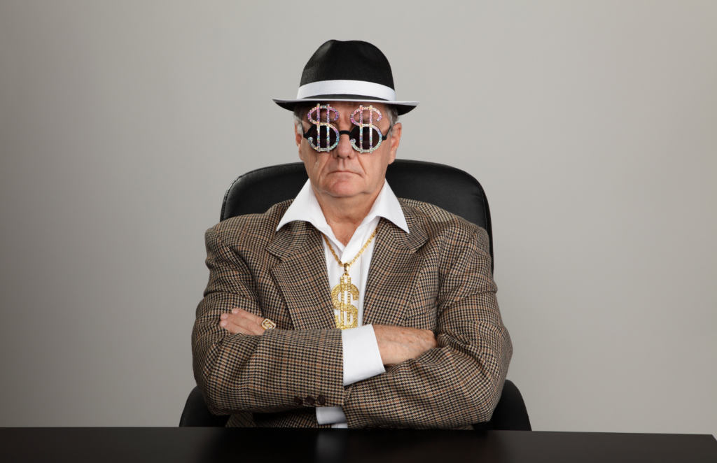 A guy pretending to be an evil, greedy loan shark
