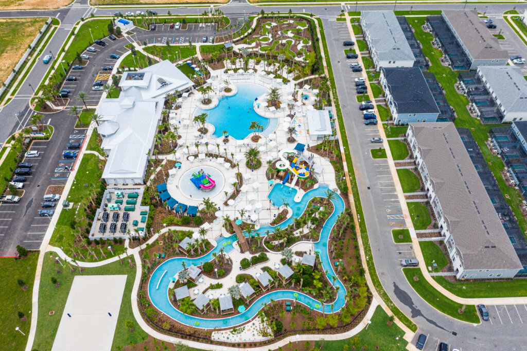 Aerial view of Windsor Cay Resort lazy river, pool, and clubhouse.
