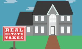 who pays real estate taxes on an inherited house