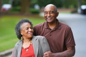 Happy black older couple smiling.