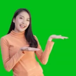 Happy asian women pointing up.