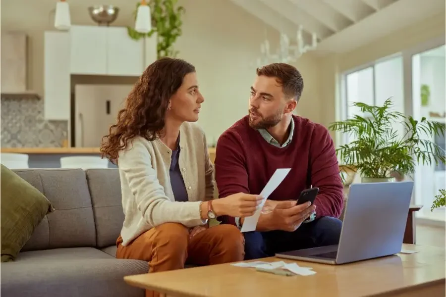 Couple discussing selling house during divorce in Portland