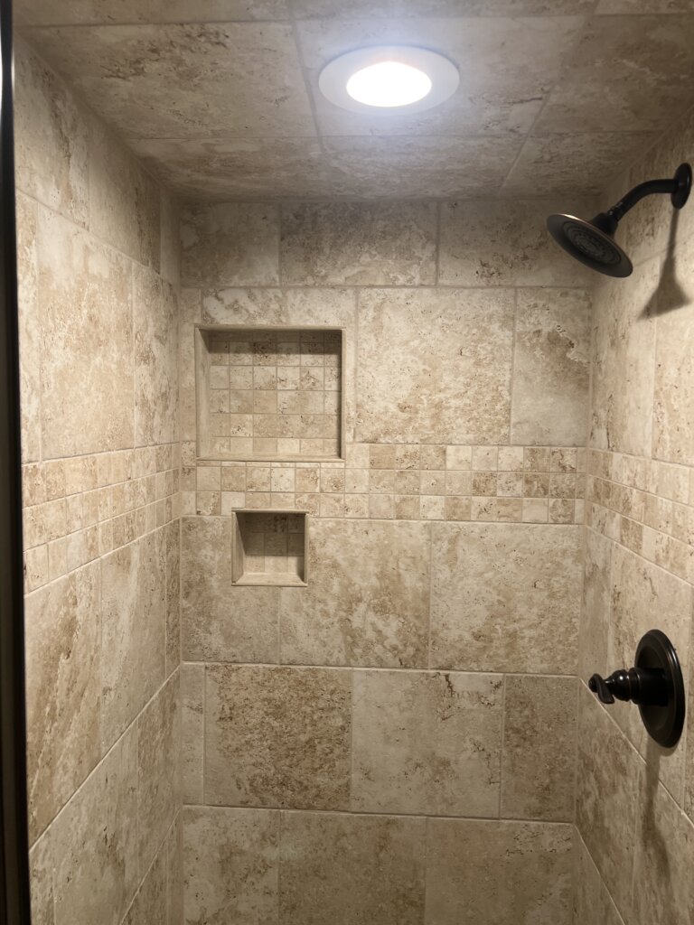 Groutless shower walls