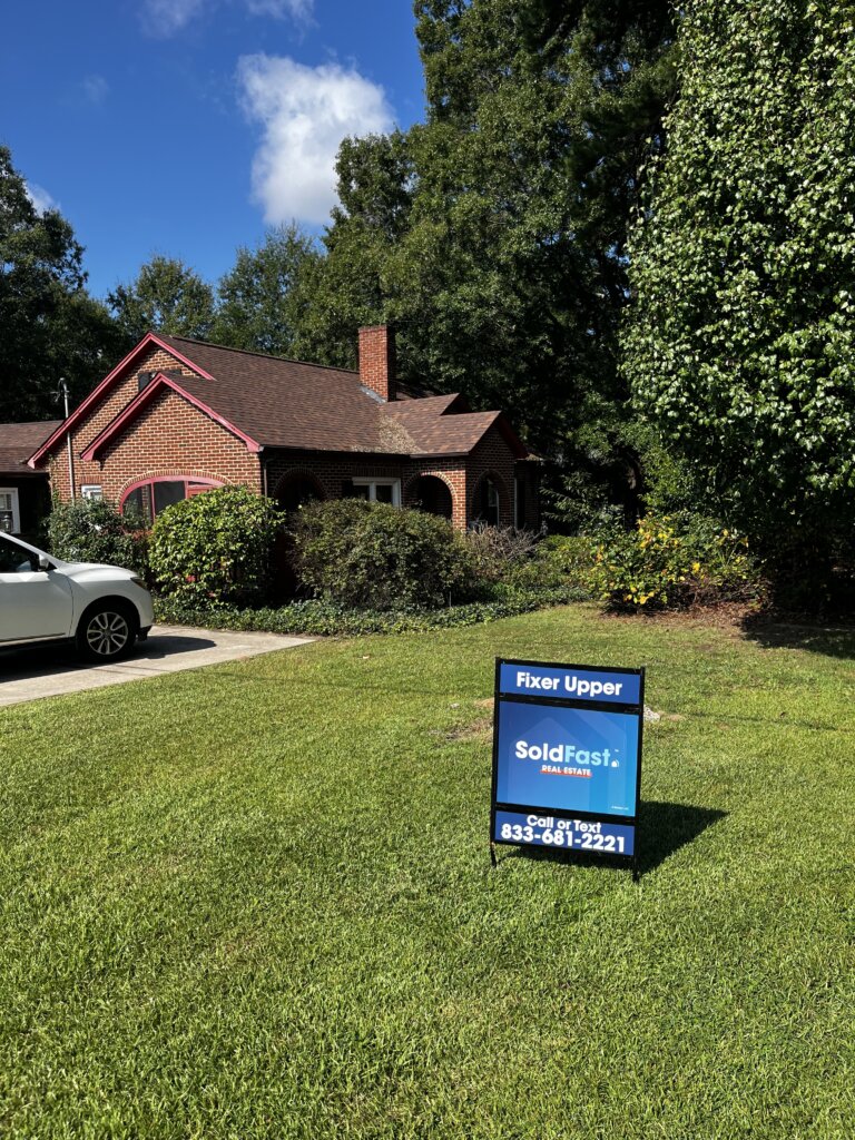 sold fast fixer upper real estate listing sign in yard