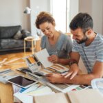 This image shows a man and a woman looking at options for home renovation projects.