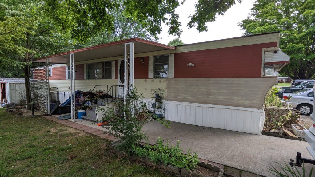 red and white 1974 mobile home for sale on a leased mobile home lot