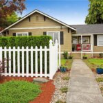 House exterior with picket fence