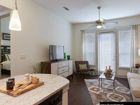 Apartment kitchen with a cutting board on the counter