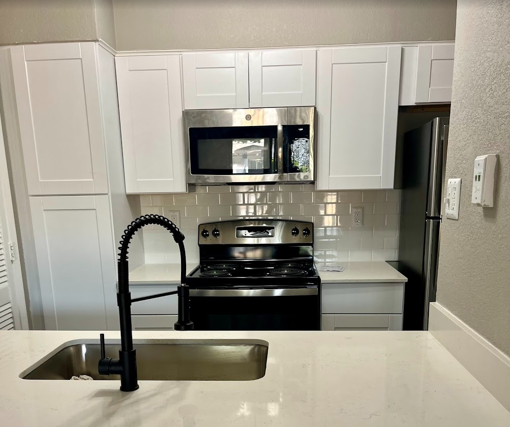 Interior unit renovation at Reserve at Lake Highlands with white shaker cabinets and quartz countertops