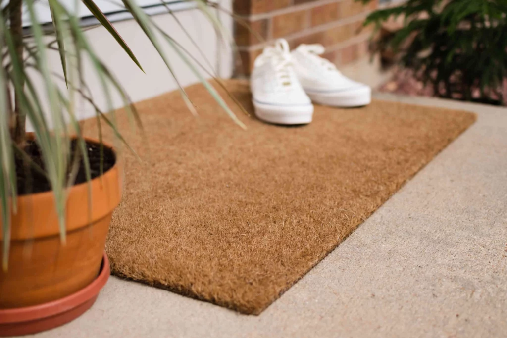 Strategically Place Doormats Both Outside and Inside Your Mobile Home to Capture Pollen and Dirt From Shoes