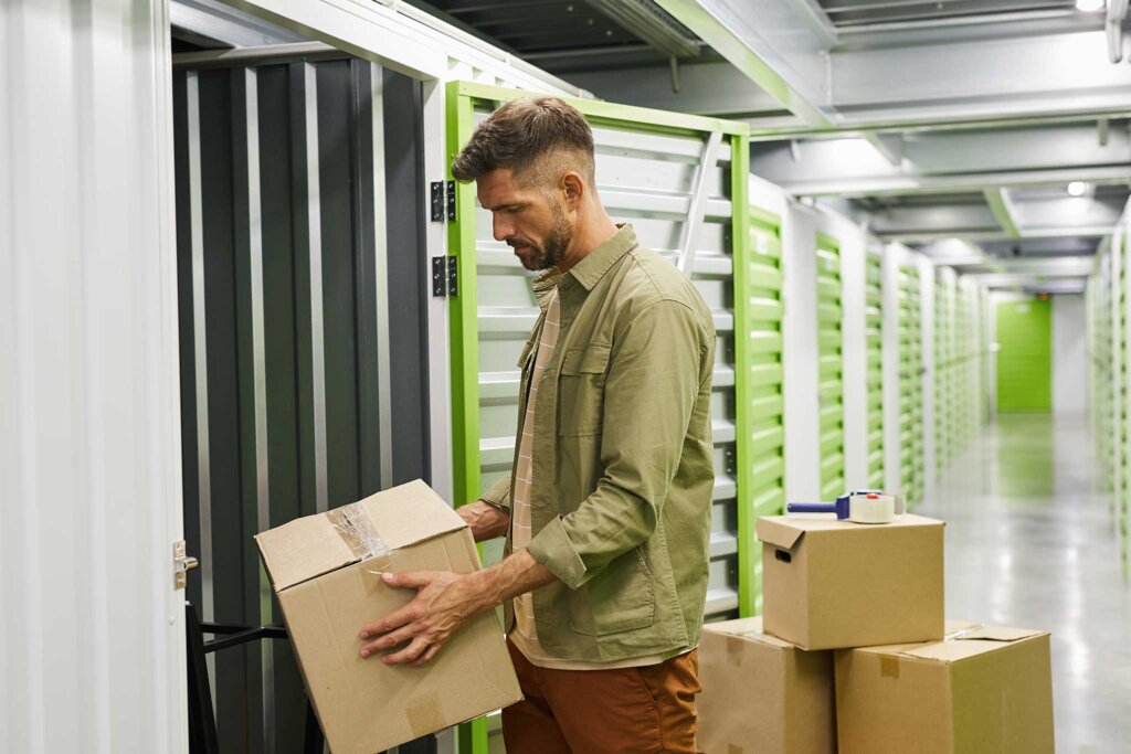 Man at storage unit with boxes