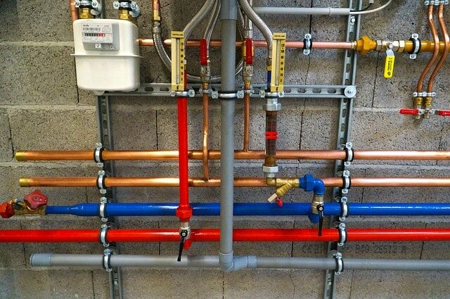 Pipes representing a new water heater as a selling point in a real estate context.