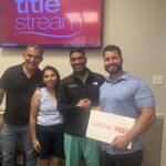 Sellers with the Bertucci Investment Group team at the title company after closing