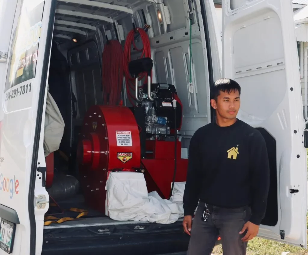 Duct stories owner in front of a van from Air Duct cleaning company in calgary 