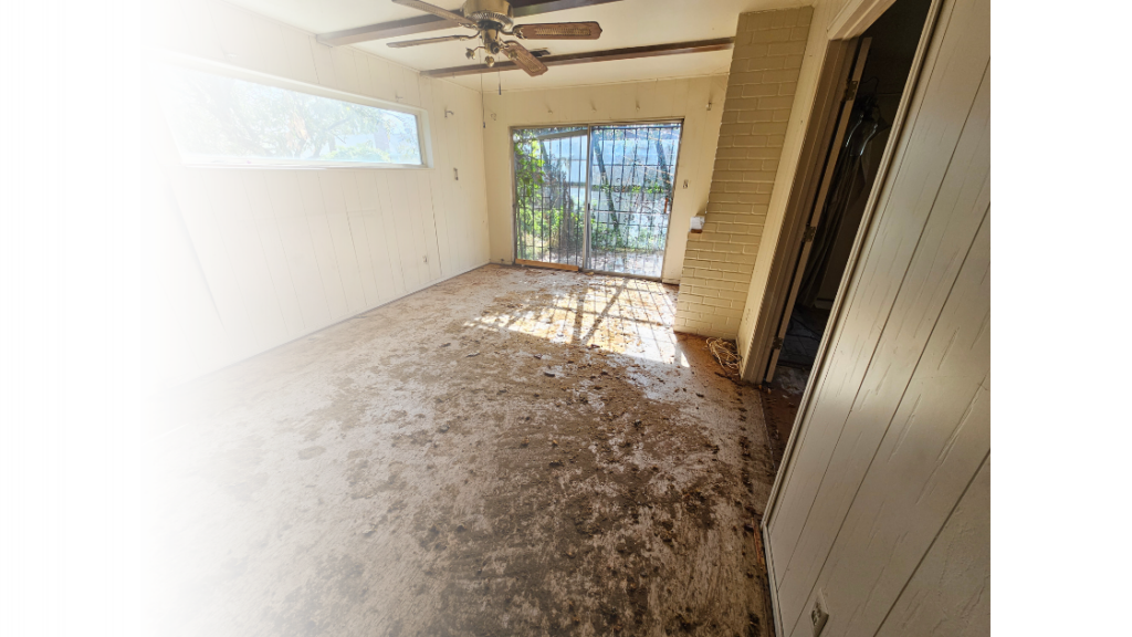 Living room that needs repairs