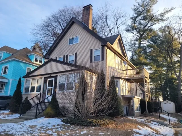 Large multi-story inherited family home on Einhorn Road in Worcester MA during winter.