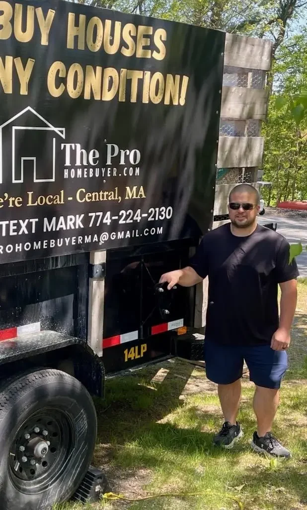 Mark Esperti standing beside a The Pro Home Buyer trailer in Central Massachusetts.
