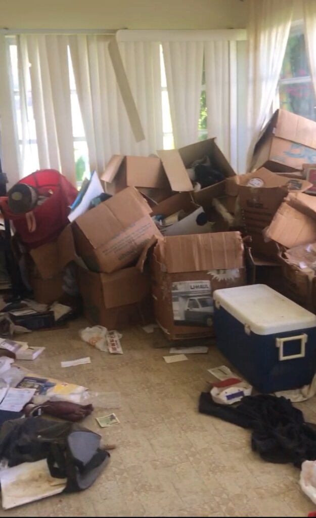 hoarder house filled with boxes and personal belongings