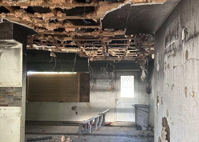 Fire damaged home interior with ceiling damage, bought for cash in Florida