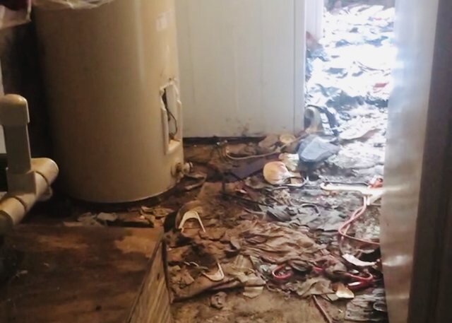 Hoarder house interior before cleanout, sold as-is for cash in Florida