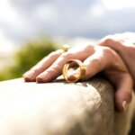 Wedding ring on a hand symbolizing selling a house in joint name divorce