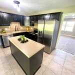 Updated kitchen with a large island and stainless steel appliances in home for sale in Princeton Indiana.