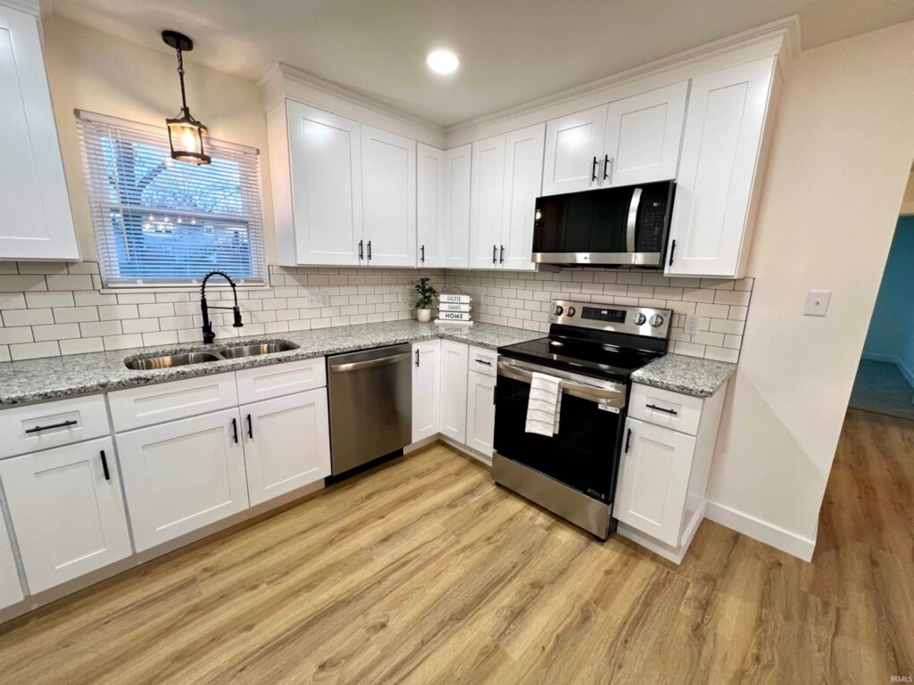 Renovated kitchen and new appliances at Newburgh house for sale.