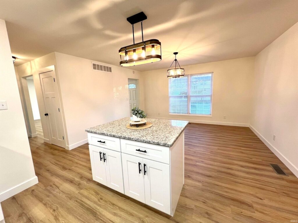 Dining area with island in Newburgh Indiana home for sale.