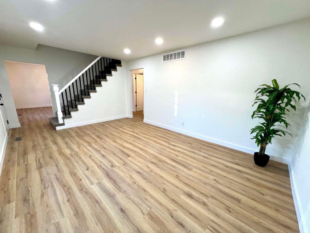Main living area in Newburgh home for sale. It has a staircase leading upstairs.