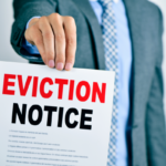 Landlord presenting a red-lettered Eviction Notice, symbolizing Ohio rental laws.