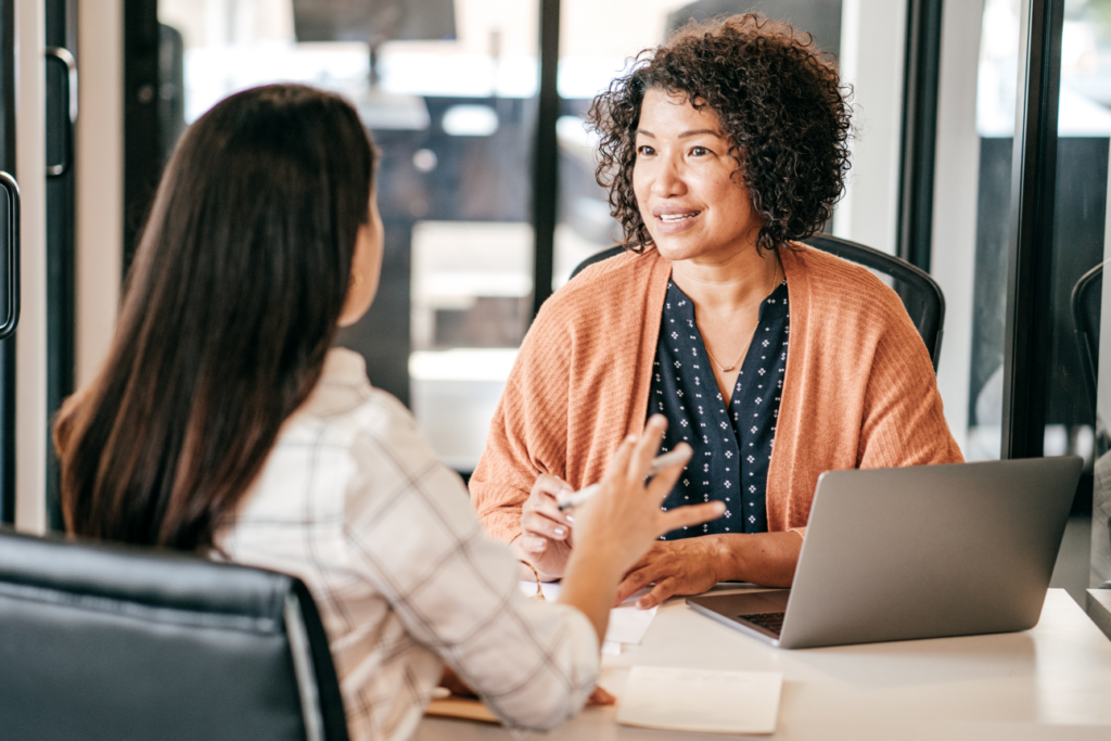 Potential home seller consulting with a professional realtor in Ohio, discussing strategies for a successful house sale.