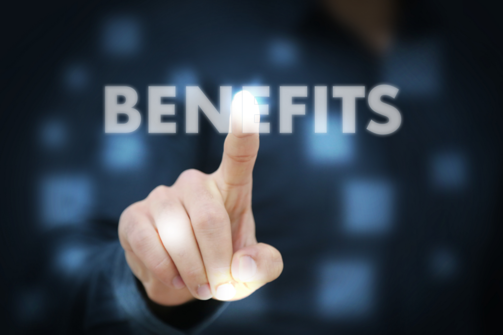 Man selecting 'BENEFITS' option on a digital interface, symbolizing the strategic advantages of understanding capital gains tax laws for Ohio property sales.