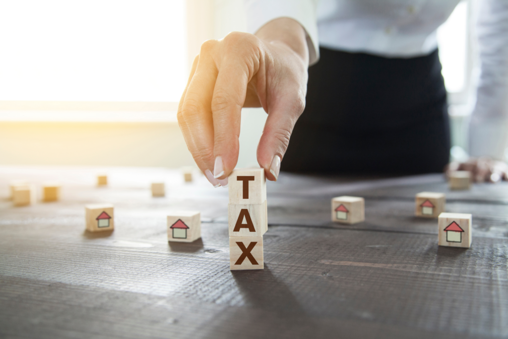 Real estate investor calculating property tax implications for selling rental homes in Ohio