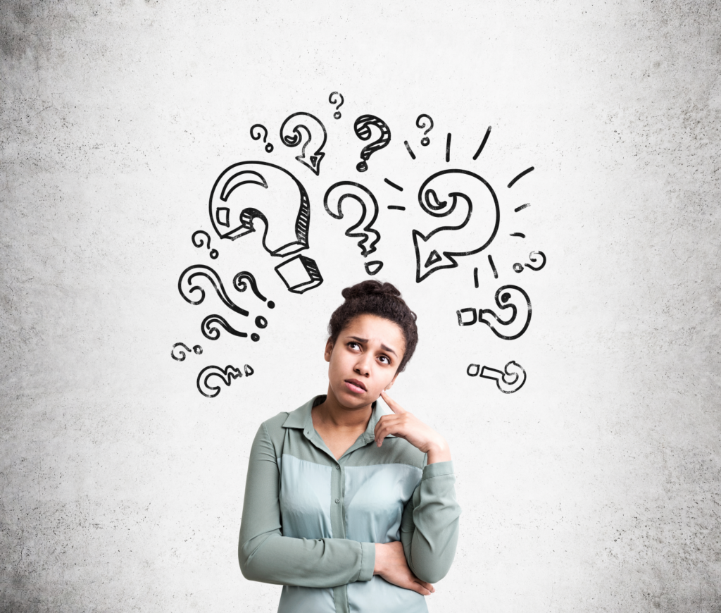 Thoughtful woman surrounded by question marks pondering the NAR settlement's impact on home selling.