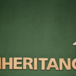 Inheritance wooden letters with house icon on green backdrop, concept for selling inherited property in Toledo.