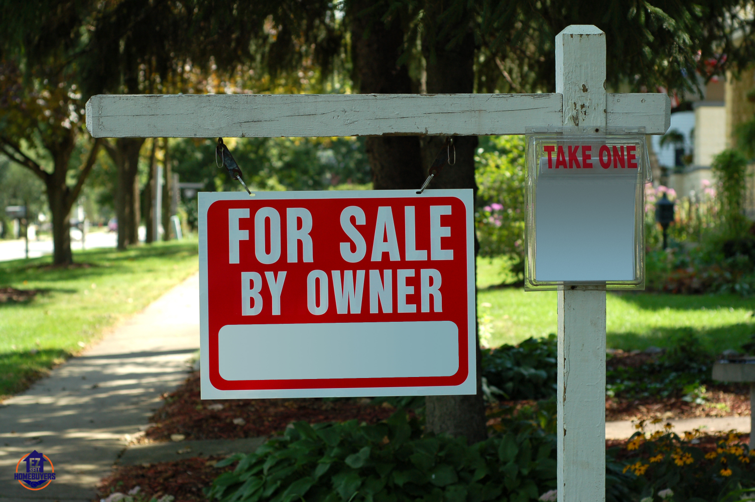 FSBO sign with flyers on a residential Cleveland street, inviting direct homebuyer inquiries