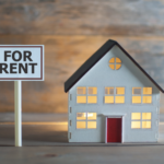 Model home with 'For Rent' sign representing Akron rental property opportunities for wealth-building.