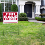 FSBO sign on the lawn of a Columbus suburb home indicating a private house sale