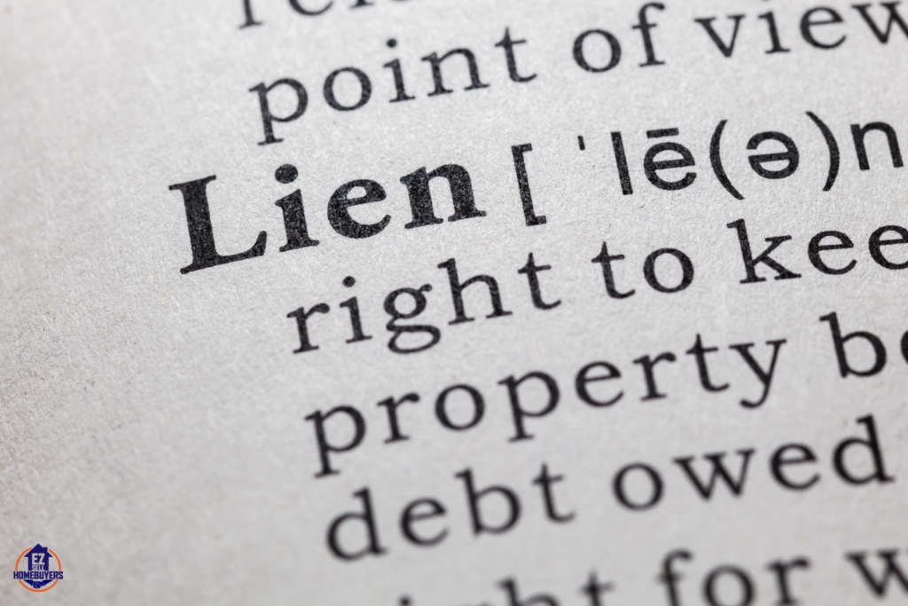 Close-up view of a dictionary definition of 'lien', illustrating the legal right to keep property because of debt, relevant to selling homes with liens in Cleveland.