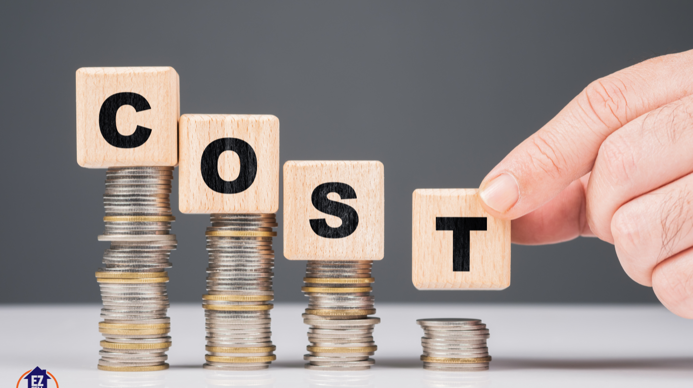 Stacked coins with wooden blocks spelling out "COST," illustrating the concept of expenses. The image represents the financial aspect of probate costs in Ohio. The logo of EZ Sell Homebuyers is visible in the lower left corner.