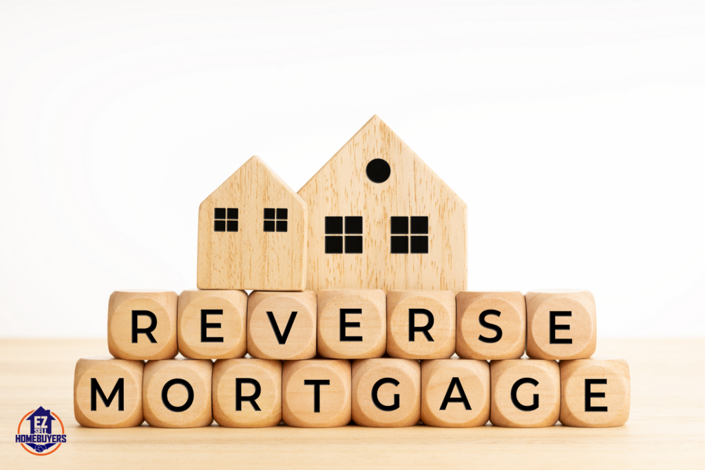 Wooden blocks spelling 'Reverse Mortgage' with small wooden house models, representing reverse mortgage implications in Ohio, probate process, and estate planning.