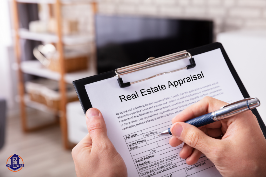Close-up of hands holding a clipboard with a real estate appraisal form, illustrating the appraisal process for selling a house in Ohio. Ideal for articles on appraisal requirements, benefits, and alternatives for Ohio home sellers.