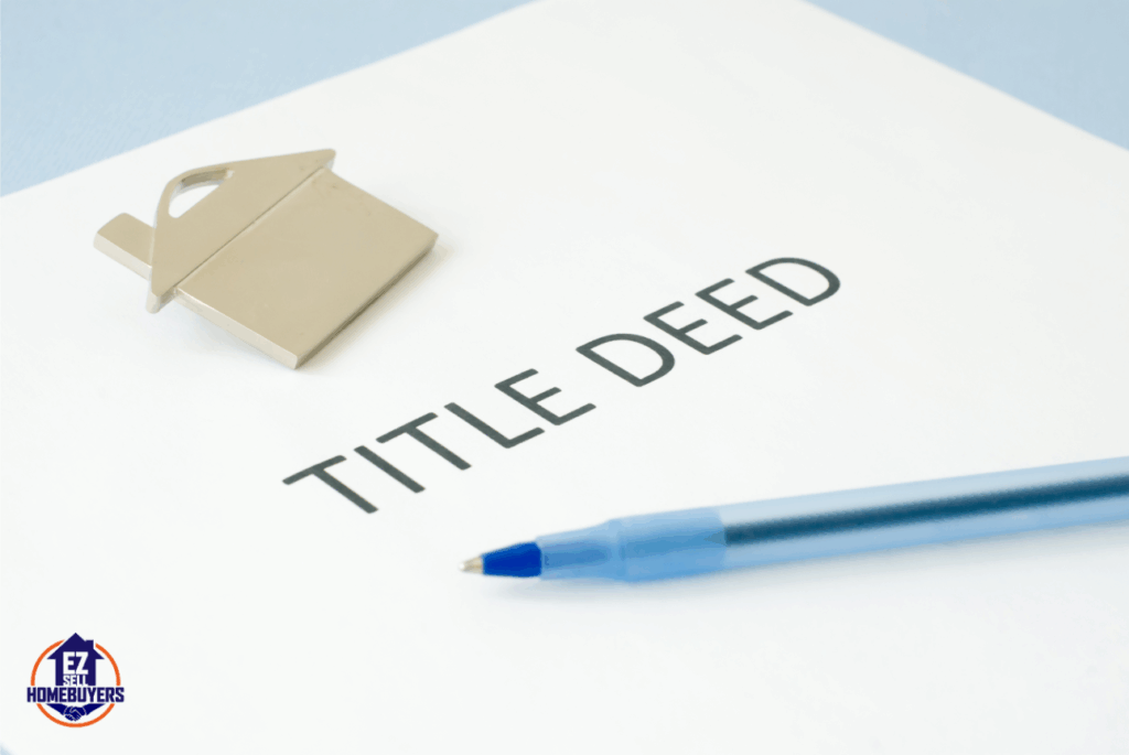 A woman signing legal documents at home, appearing focused and contemplative—symbolizing a personal transition like removing a name from a house deed.