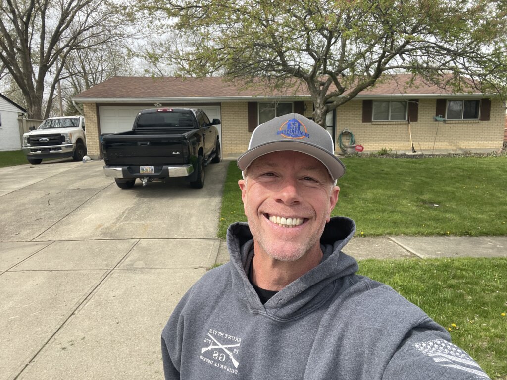 EZ Sell Homebuyers owner in front of a recently purchased home at 7371 Cedar Knolls Drive in Dayton Ohio sold for cash with fast closing