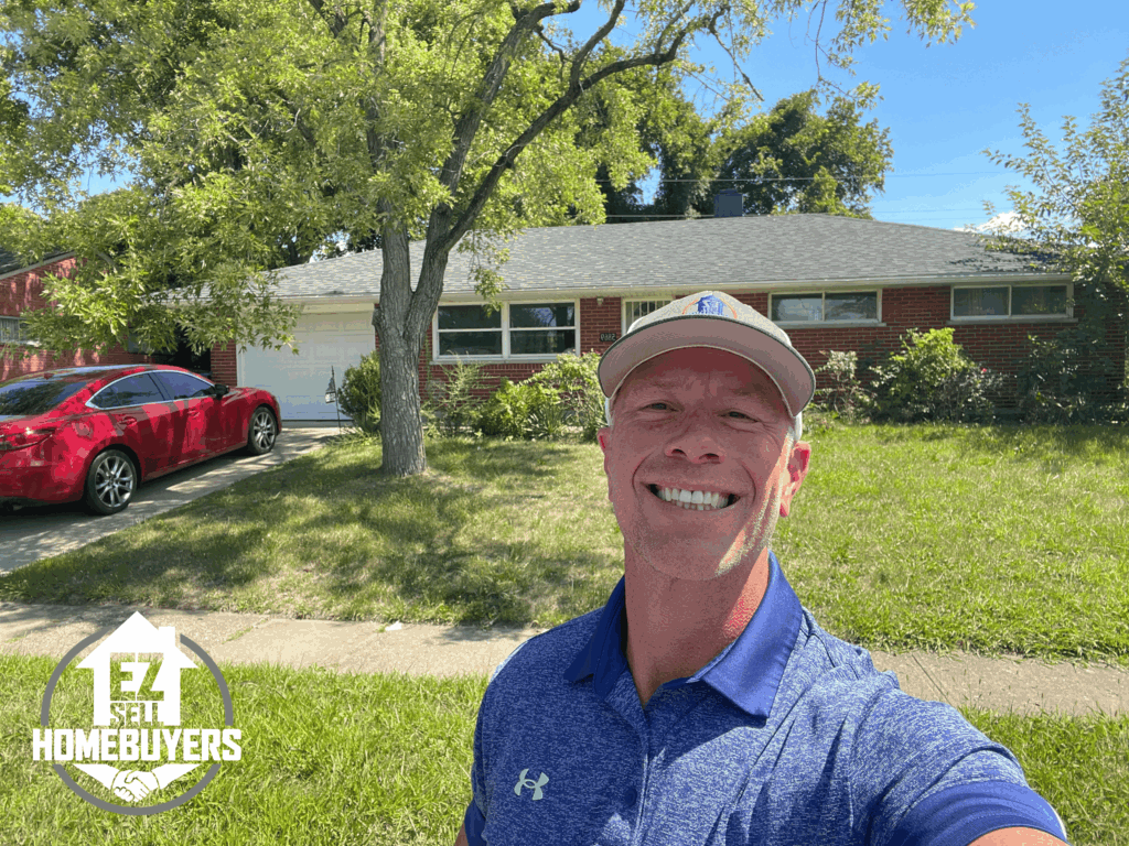 EZ Sell Homebuyers owner Mike Wall in front of a brick ranch home purchased in Huber Heights, Ohio