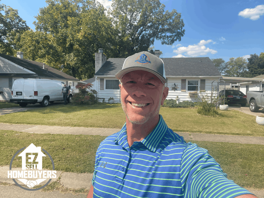 Mike Wall of EZ Sell Homebuyers standing in front of a single-family home in Kettering, Ohio after purchasing the property for cash