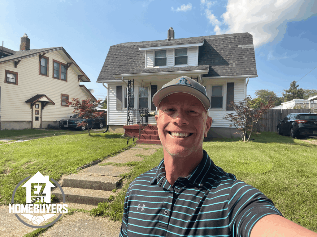 Mike Wall of EZ Sell Homebuyers in front of a West Carrollton, Ohio home purchased for cash