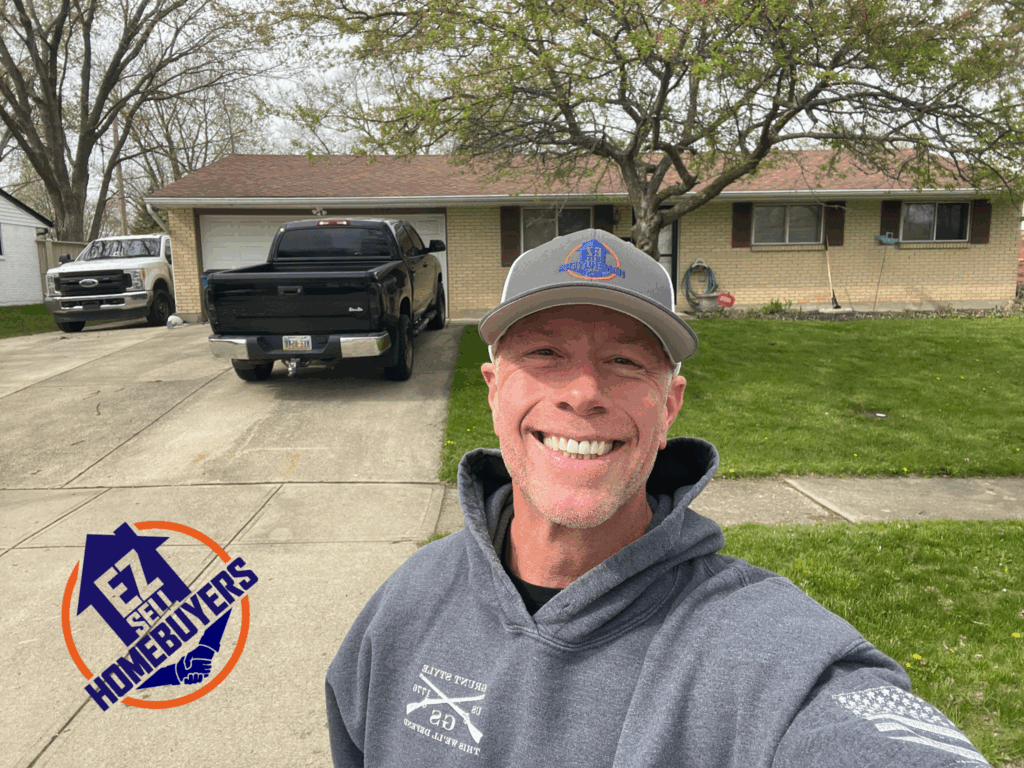 EZ Sell Homebuyers owner in front of a recently purchased home at 7371 Cedar Knolls Drive in Dayton Ohio sold for cash with fast closing