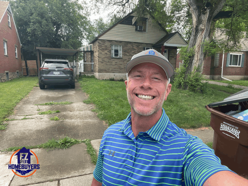 Mike Wall in front of a Fairborn rental house he bought for cash to help a landlord avoid eviction stress.